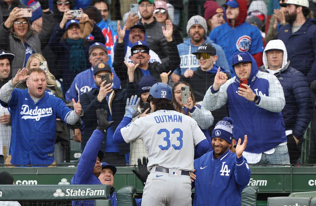 Dodgers center fielder James Outman celebrates after hitting a two-run home run against the Cubs in the ninth inning Saturday at Wrigley Field. 