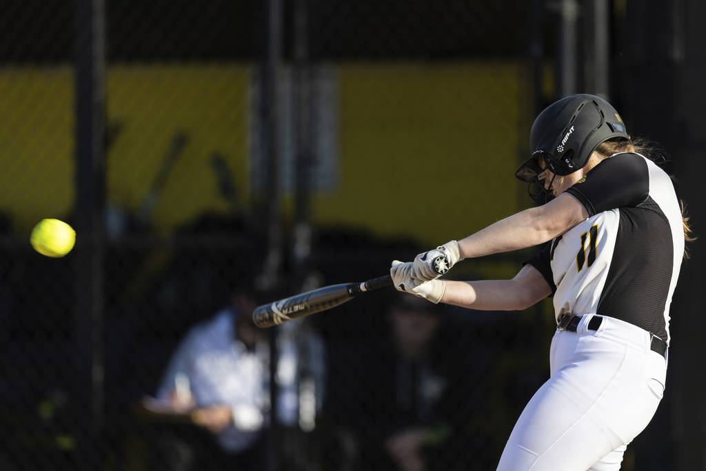 Richards' Kyra Olejniczak (11) hits a home run against Oak Forest during a South Suburban Conference crossover game in Oak Lawn on Thursday, April 6, 2023.