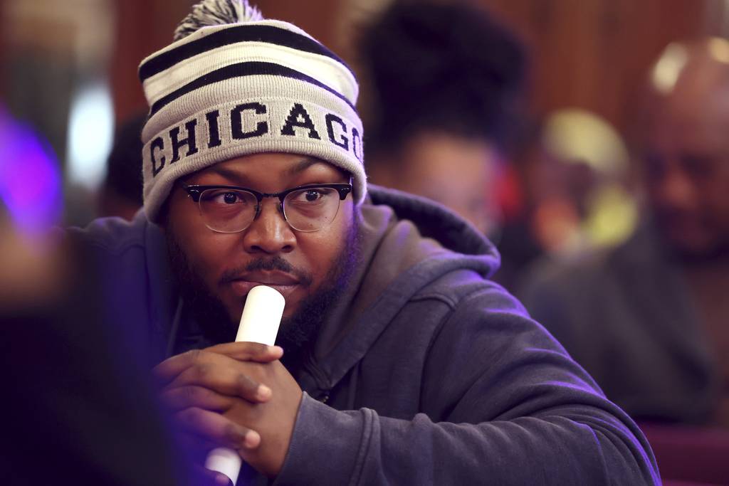 Anthony Bryant listens in as the Community Commission for Public Safety and Accountability holds a public meeting at St. Sabina Catholic Church on April 19, 2023.