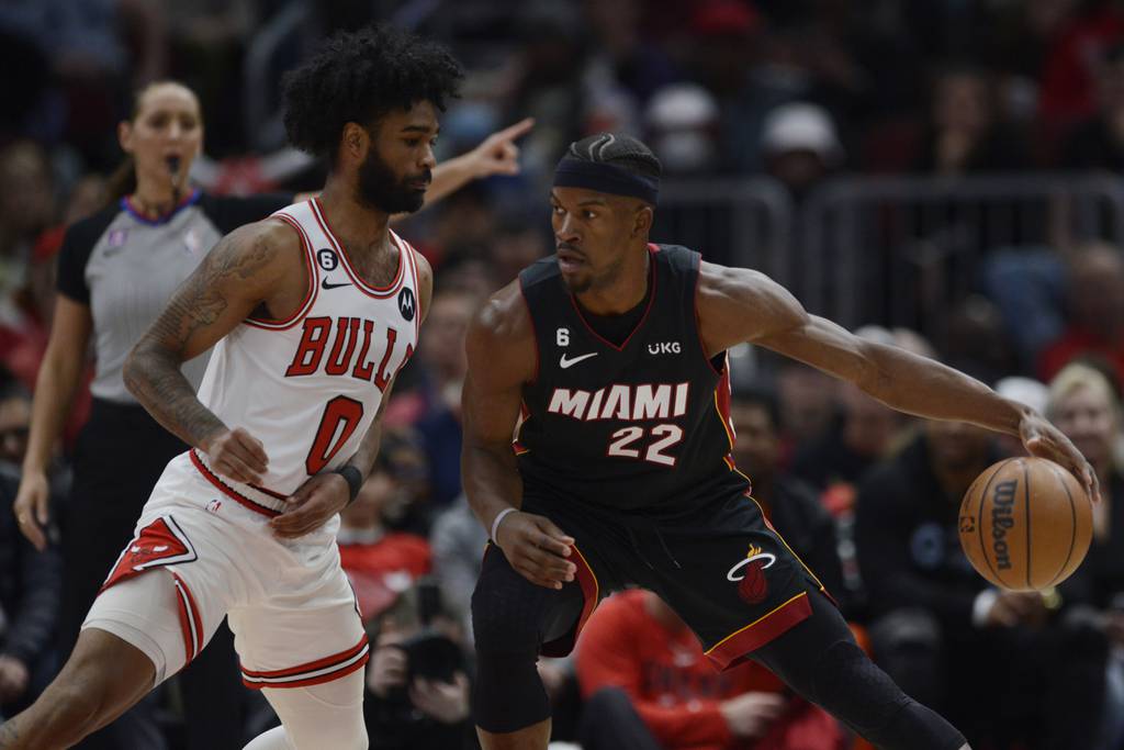 The Heat's Jimmy Butler, left, drives against Bulls guard Coby White on March 18 at the United Center. 
