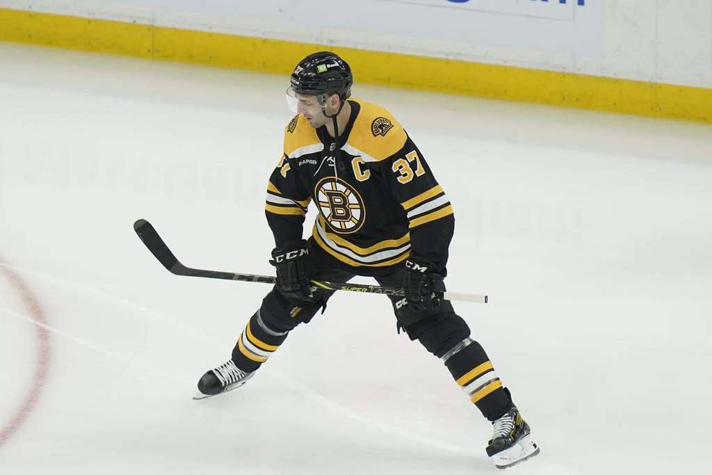 Bruins center Patrice Bergeron warms up before a game against the Blue Jackets on March 30, 2023.