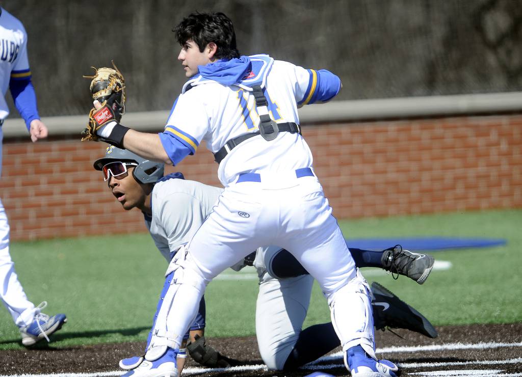 Thornwood's Shemar Harris (3) gets tagged out at home by Sandburg catcher Dominic Diamond (14) during a nonconference game in Orland Park on Friday, April 7, 2023.