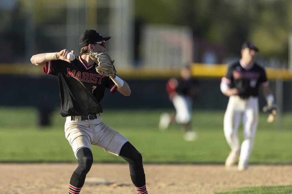 Marist’s Justin Lang (7) throws to first base for an out against St. Laurence in the top of the seventh inning of a nonconference game in Chicago on Tuesday, April 18, 2023.