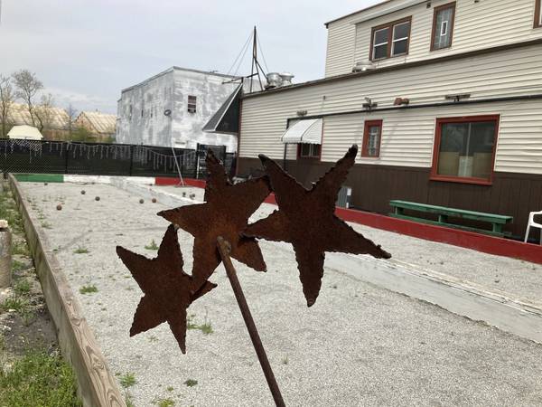 Weeds emerge from the bocce courts at 3 Star Tavern in Chicago Heights, a gathering spot for residents of the Hungry Hill neighborhood since 1936.