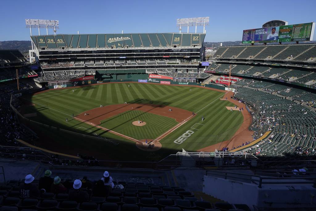 Fans watch a game at Oakland Coliseum between the Athletics and Rangers on July 23, 2022. The Athletics have signed a binding agreement to purchase land for a new retractable roof stadium in Las Vegas after being unable to build a new venue in the Bay Area.