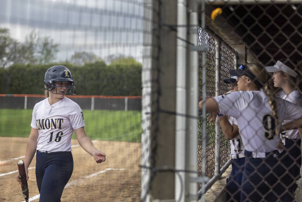 Lemont’s Sage Mardjetko (16) talks with her teammates while in the on-deck circle against Shepard during a South Suburban Conference crossover in Palos Heights on Thursday, April 20, 2023.