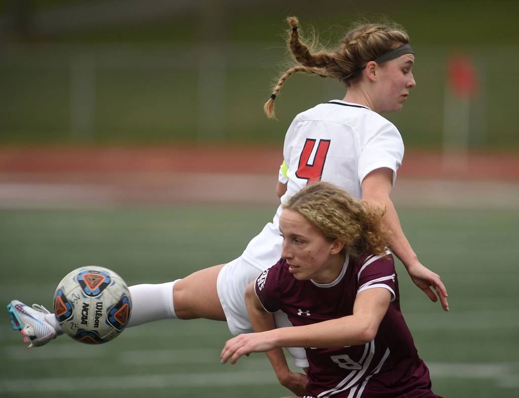 Lincoln-Way Central's Christine Erdman (4) and Lockport's Bella Diorio (8) collide while going for the ball during a SouthWest Suburban Conference crossover in Lockport on Tuesday, April 4, 2023.
