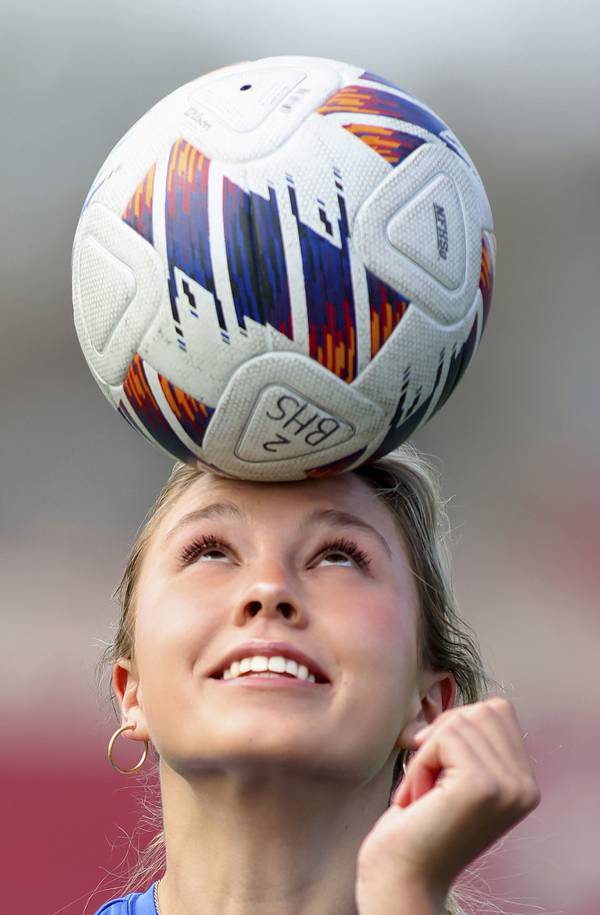 Barrington’s Brooke Brown heads the ball during a practice on campus on Friday, April 14, 2023.