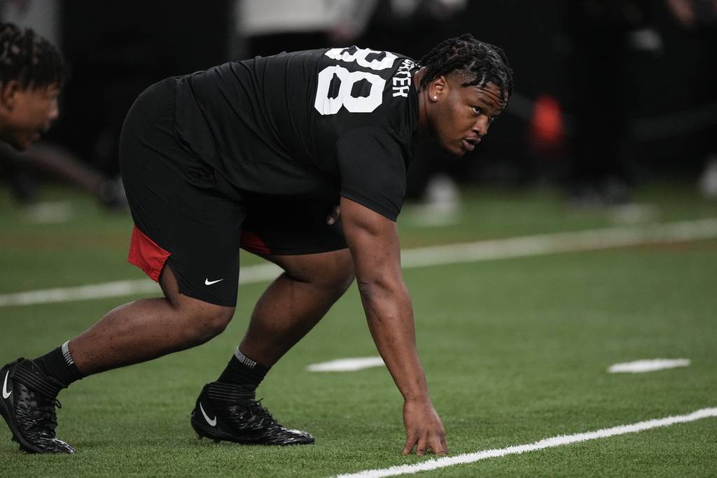 Defensive lineman Jalen Carter runs drills during Georgia's pro day on March 15, 2023.