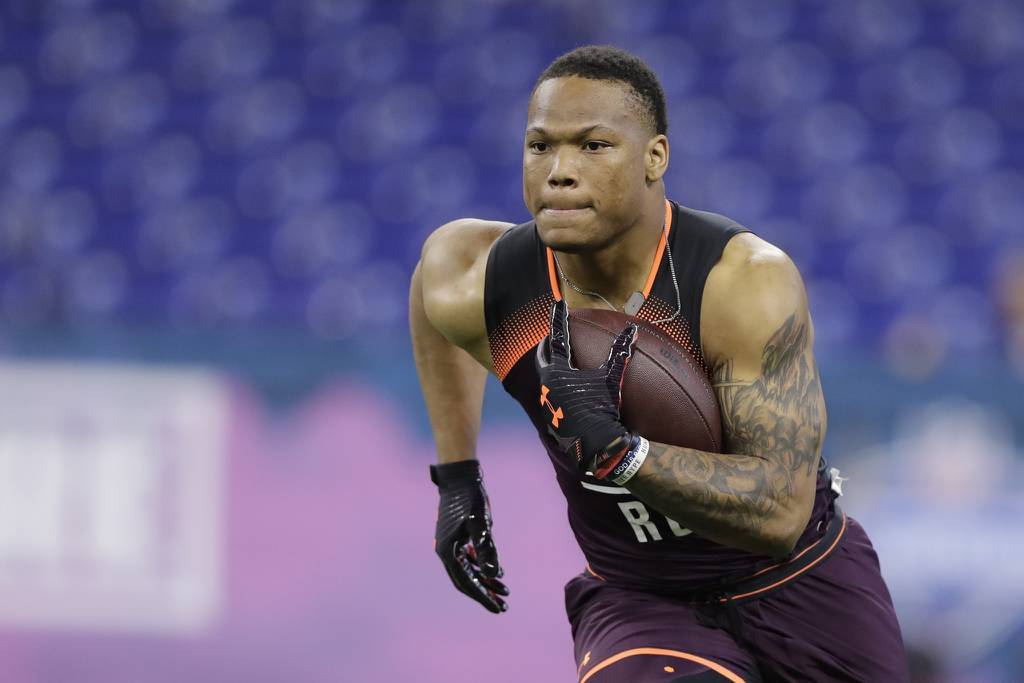 Running back David Montgomery runs a drill during the NFL combine on March 1, 2019.