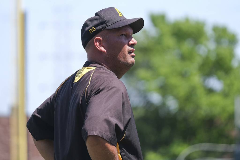 Andrew coach Dave DeHaan mans third base against Sandburg during a Class 4A regional semifinal game in Crestwood on Friday, June 4, 2021.