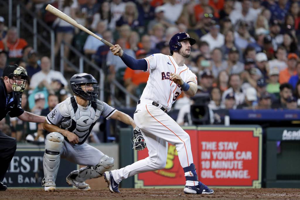 The Astros' Kyle Tucker watches his RBI single in front of White Sox catcher Seby Xavala during the seventh inning Saturday in Houston. 