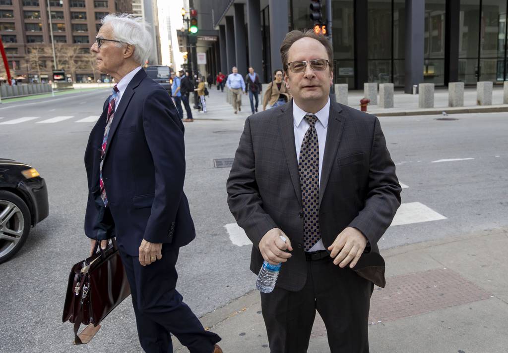 Edward Moody, right, a longtime precinct captain for former House Speaker Michael Madigan, departs the Dirksen U.S. Courthouse after testifying on April 11, 2023.
