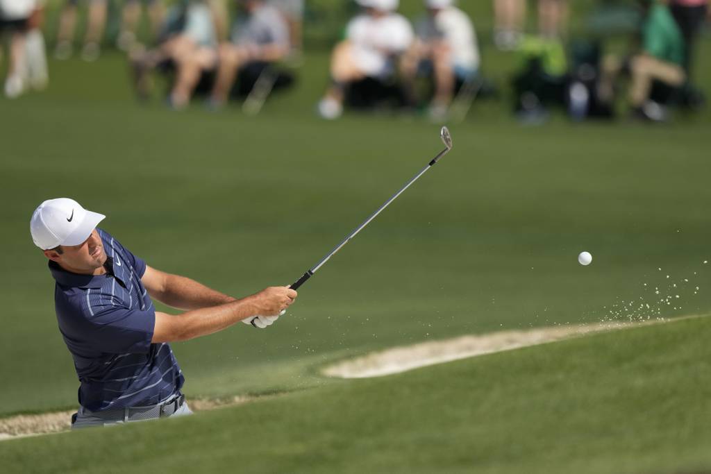 Scottie Scheffler hits from the bunker on the seventh hole during a practice round for the Masters at Augusta National Golf Club on April 5, 2023.