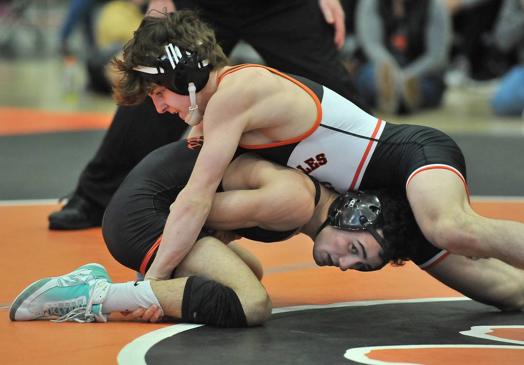 St. Charles East's Ben Davino, top, tries to control Libertyville's Caelan Riley during a 120 -pound match at the Wheaton Warrenville South Mega Duals in Wheaton on Saturday, Dec. 4, 2021.