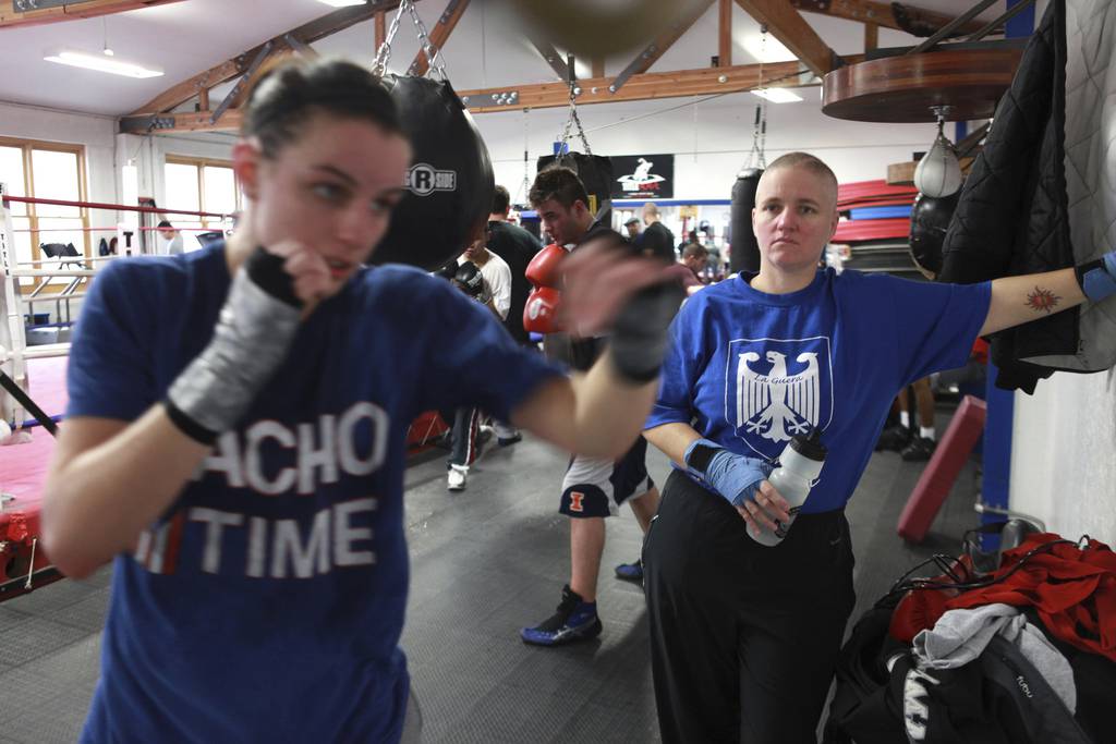 Boxer Rita Figueroa, right, watches as she trains boxer Kristin Gearhart at the Chicago Boxing Club in  Bridgeport on Jan 5, 2010. 