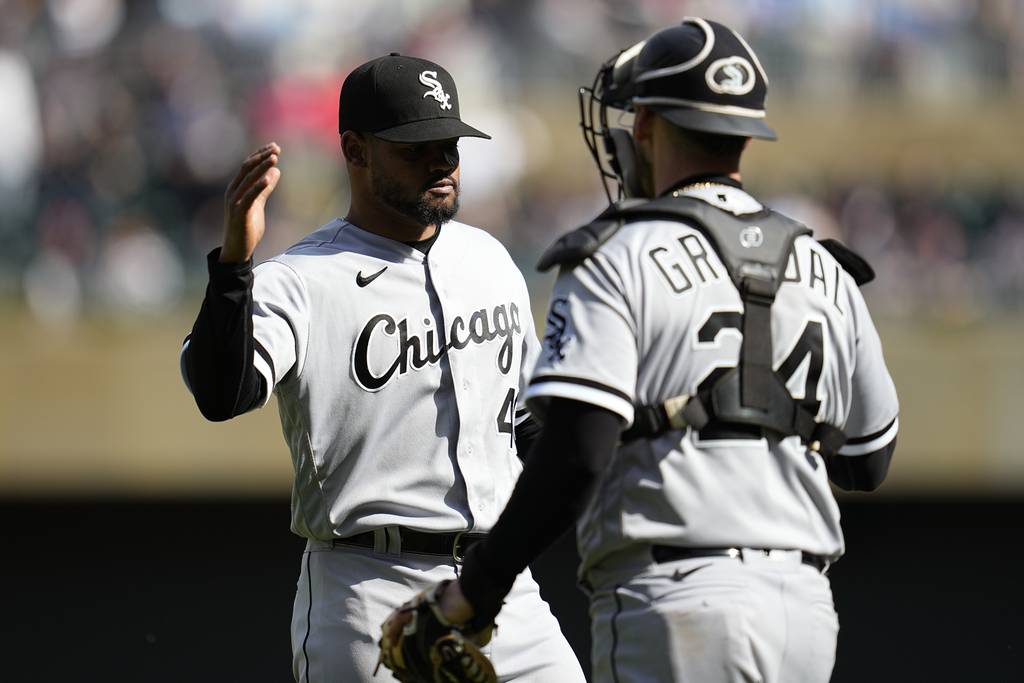 White Sox reliever Reynaldo Lopez, left, and catcher Yasmani Grandal celebrate after the final out against the Twins on Monday, April 10, 2023, in Minneapolis.