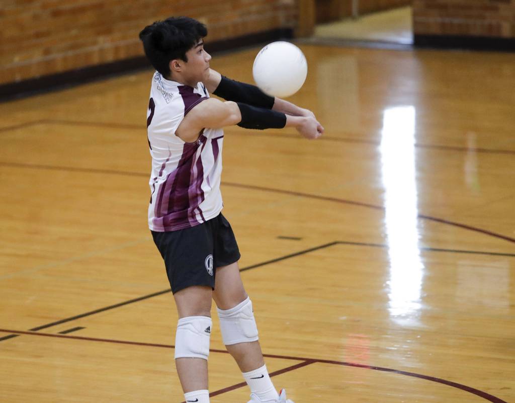 Lockport’s Kevin Rodriguez bumps the ball against Oak Lawn during a nonconference match in Lockport on Thursday, April 6, 2023.