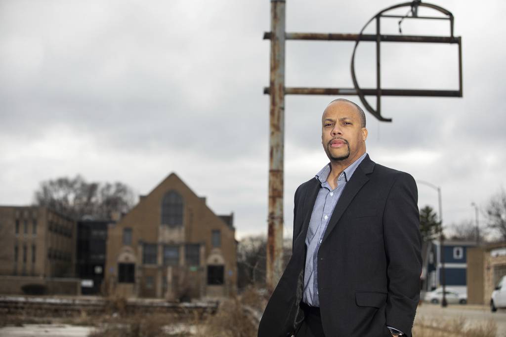 Abraham Lacy, president of the Far South Community Development Corp., stands in one of several vacant lots that could be used for a medical building in the Roseland neighborhood, March 2, 2023. 