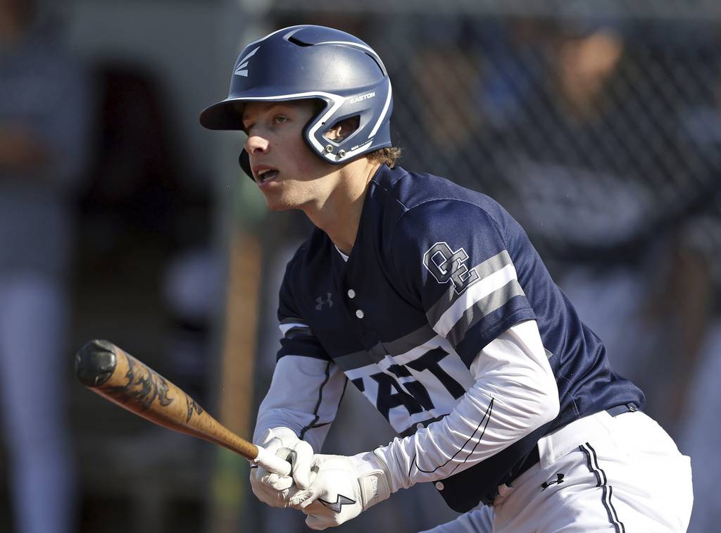 Oswego East's Mike Polubinski (1) follows through on a hit against West Aurora during a Southwest Prairie West game on Tuesday, April 18, 2023.