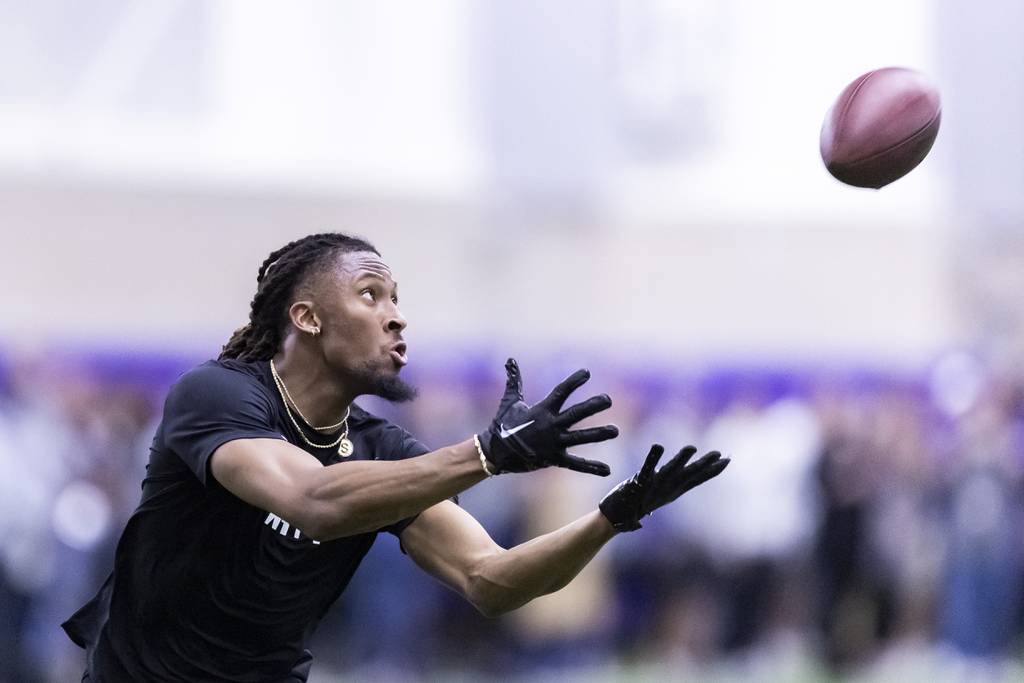 Wide receiver Quentin Johnston catches a pass during TCU's pro day on March 30, 2023.