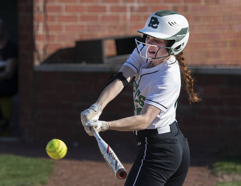 Providence's Genevieve Peterson takes a swing against St. Laurence during a GCAC crossover game on Monday, April 10, 2023.
