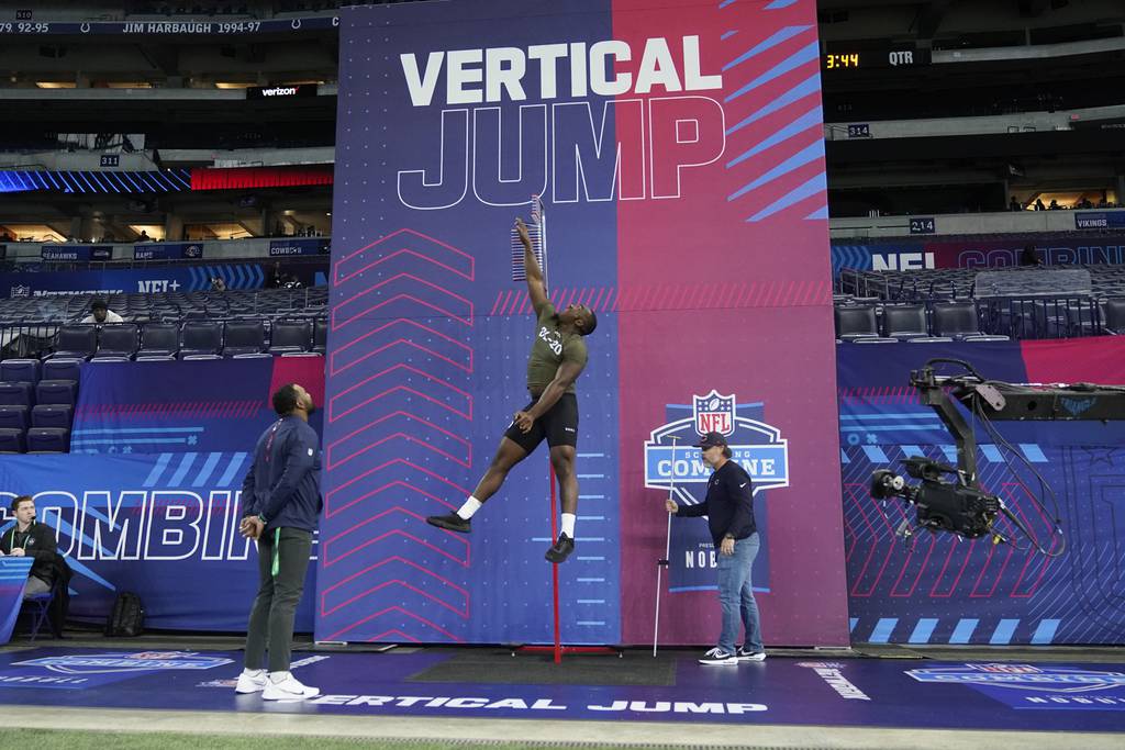 Northwestern defensive lineman Adetomiwa Adebawore runs a drill at the NFL combine in Indianapolis on March 2, 2023.