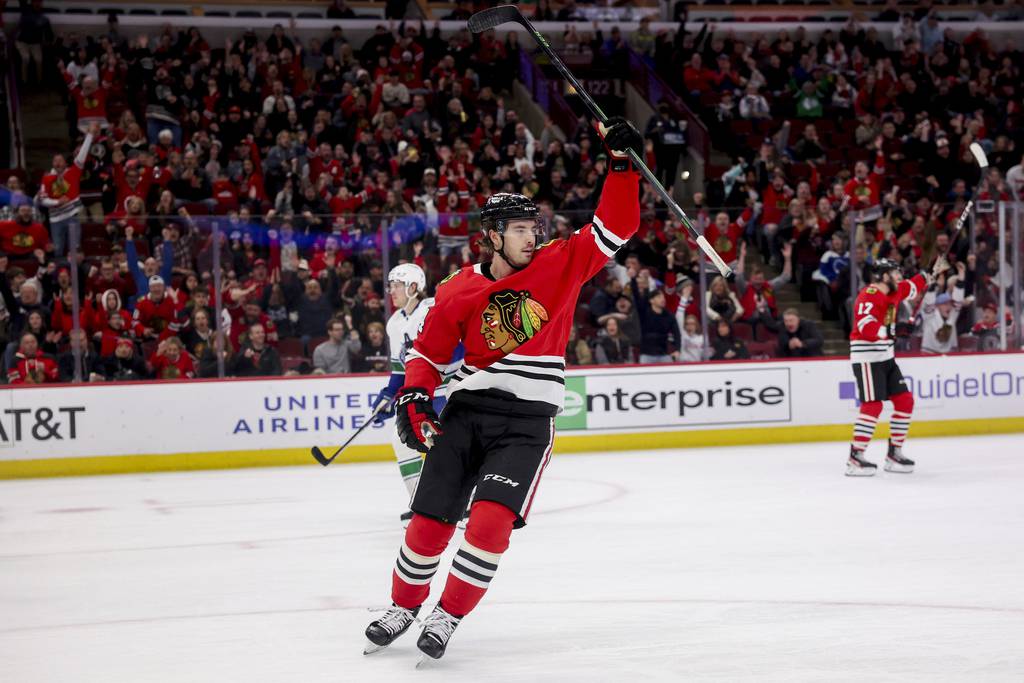Blackhawks left wing Boris Katchouk celebrates after assisting defenseman Connor Murphy on a goal during the first period against the Canucks on March 26 at the United Center. 