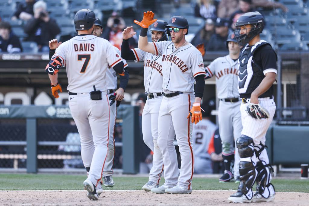 San Francisco Giants first baseman J.D. Davis (7) celebrates with his teammates after hitting a grand slam in the ninth inning against Chicago White Sox at Guaranteed Rate Field Thursday, April 6, 2023. (Eileen T. Meslar/Chicago Tribune)
