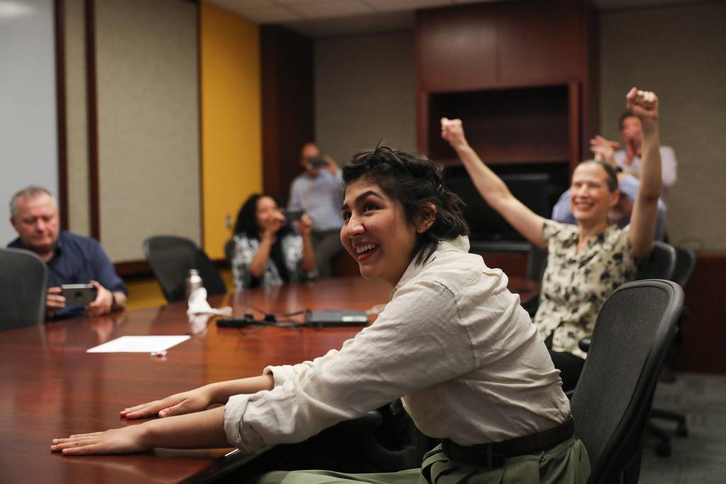 Former Chicago Tribune employee Cecilia Reyes reacts as she and Madison Hopkins of the Better Government Association, not pictured, win the 2022 Pulitzer Prize in Local Reporting on May 9, 2022.