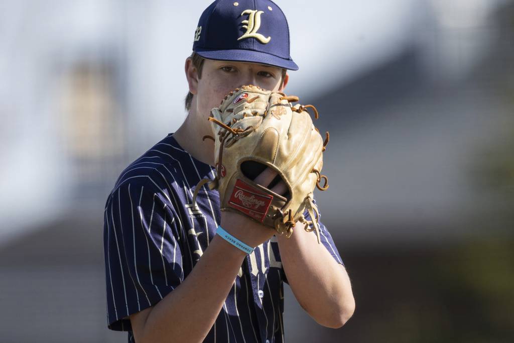 Lemont’s Cannon Madej (33) looks toward the plate before delivering a pitch against Stagg during a nonconference game in Lemont on Saturday, April 8, 2023.