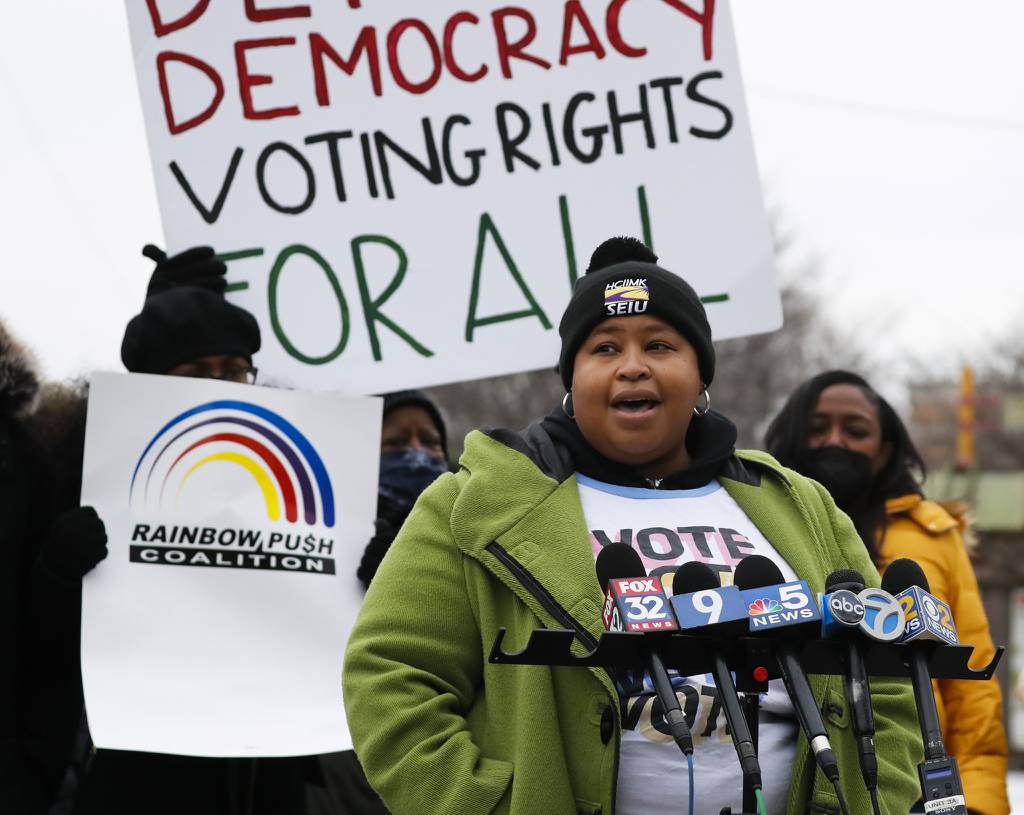 Erica Bland-Durosinmi, executive vice president of the regional SEIU Healthcare chapter that includes Illinois, joins others as they rally for voting rights in 2022. 