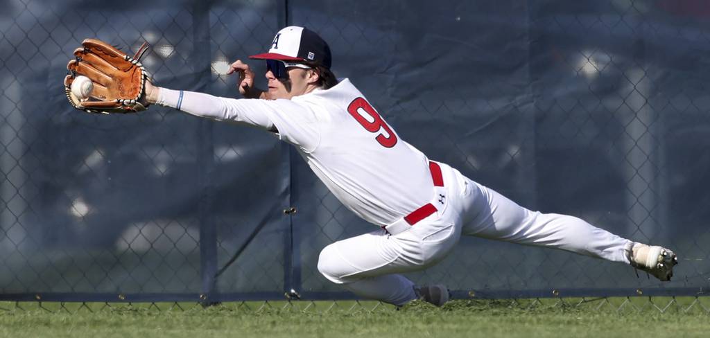 West Aurora's Katcher King (9) makes a diving catch in the first inning against Oswego East during a Southwest Prairie West game on Tuesday, April 18, 2023.
