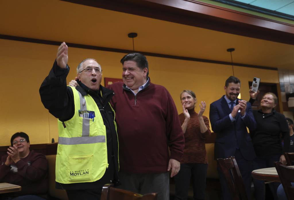 State Rep. Marty Moylan, left in vest, speaks at a campaign stop along with Gov. J.B. Pritzker and other Democratic politicians and candidates at the Sugar Bowl restaurant on Oct. 31, 2022, in Des Plaines.