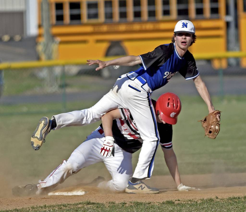 Newark's Jake Kruser looks for the call as Aurora Christian's Grant Keppy steals second base during a nonconference game in Newark on Tuesday, April 11, 2023.