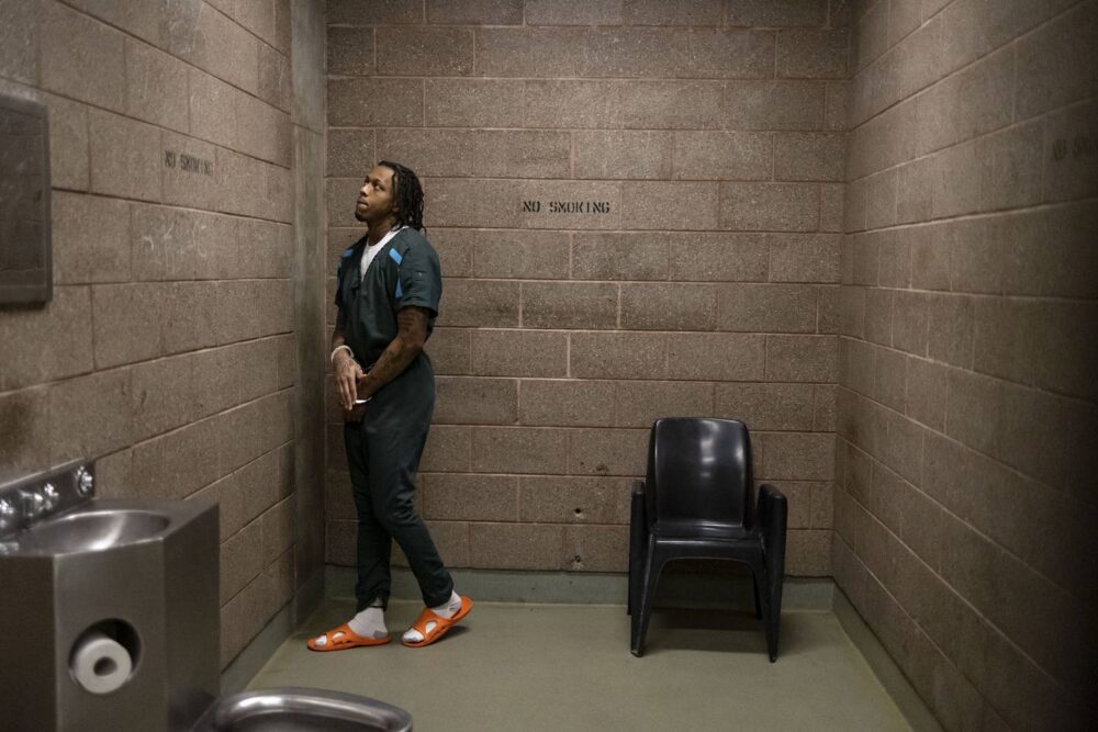 Zeron Moody waits in a basement holding cell at the Cook County Jail before walking to the Leighton Criminal Court Building in October.