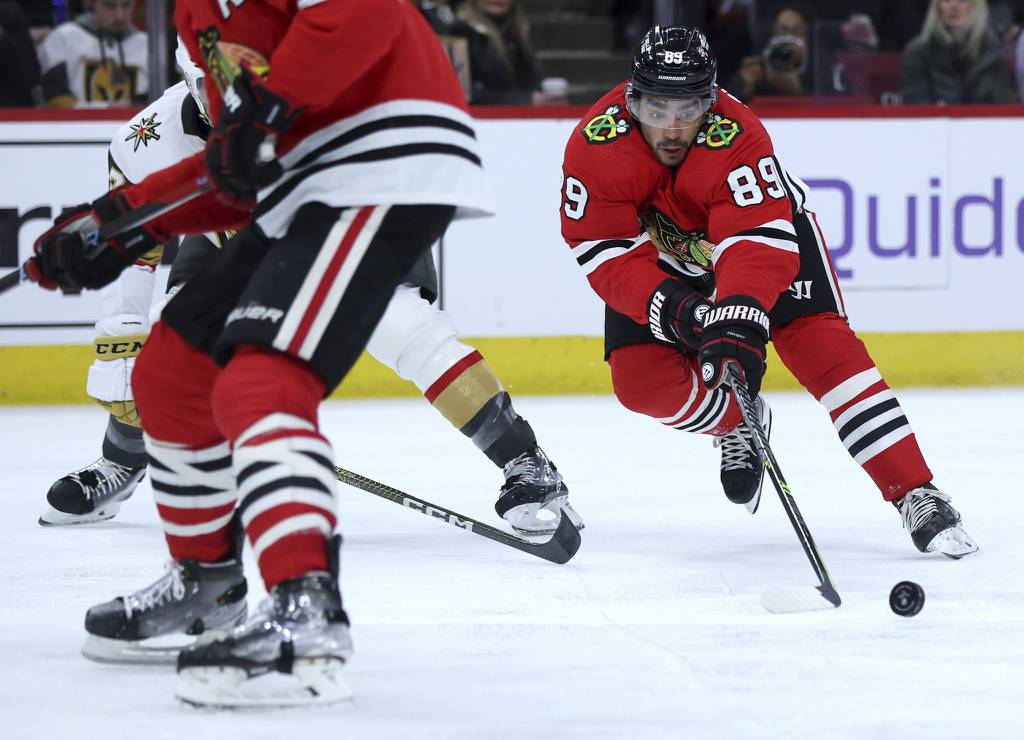 Blackhawks center Andreas Athanasiou (89) reaches for the puck in the third period against the Golden Knights on Feb. 21 at the United Center. 