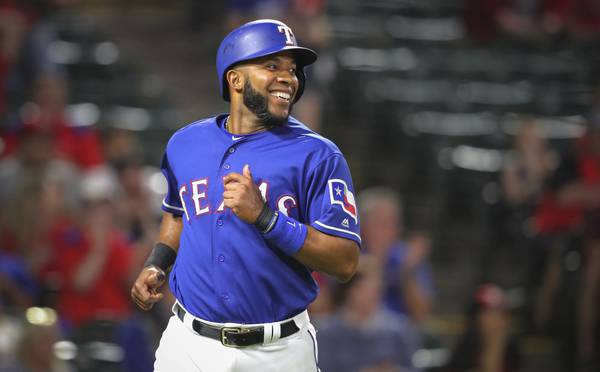 Rangers shortstop Elvis Andrus smiles as he scores during a game at Globe Life Park on March 26, 2018.