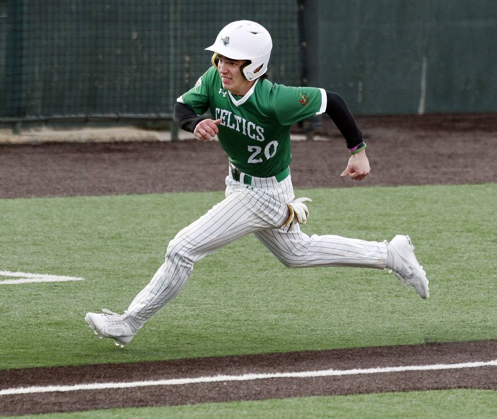 Providence's Eddie Olszta scores against Hinsdale Central during the fifth inning of a nonconference game at Duly Health and Care Field in Joliet on Wednesday, April 5, 2023.