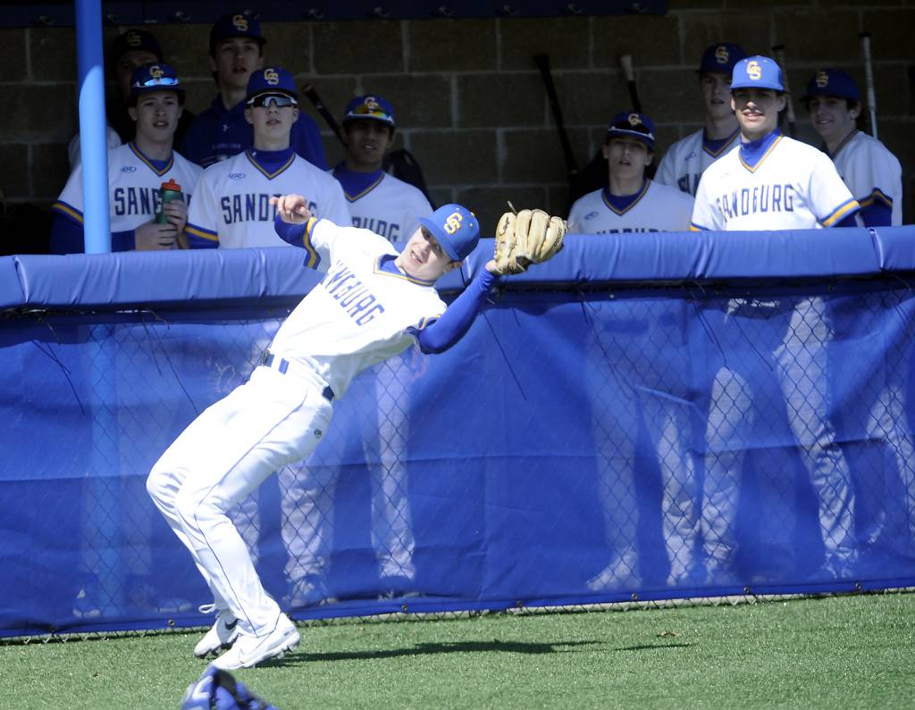 Sandburg third baseman Dominic Palumbo (23) makes a catch in foul territory in front of his bench against Thornwood during a nonconference game in Orland Park on Friday, April 7, 2023.