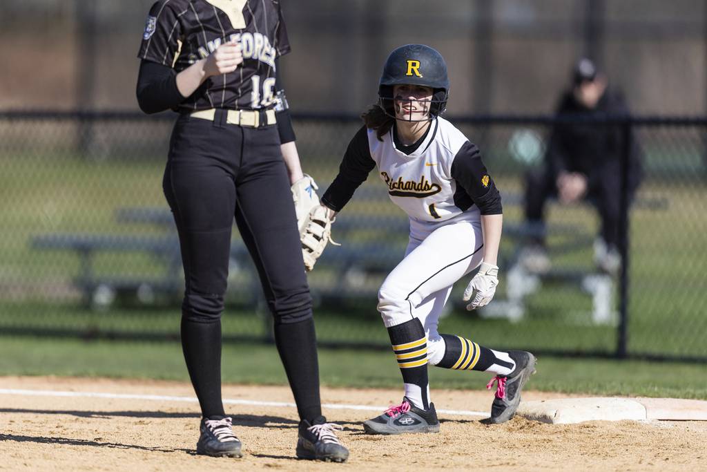Richards' Violet McIntyre (1) looks on from first base against Richards during a South Suburban Conference crossover game in Oak Lawn on Thursday, April 6, 2023.