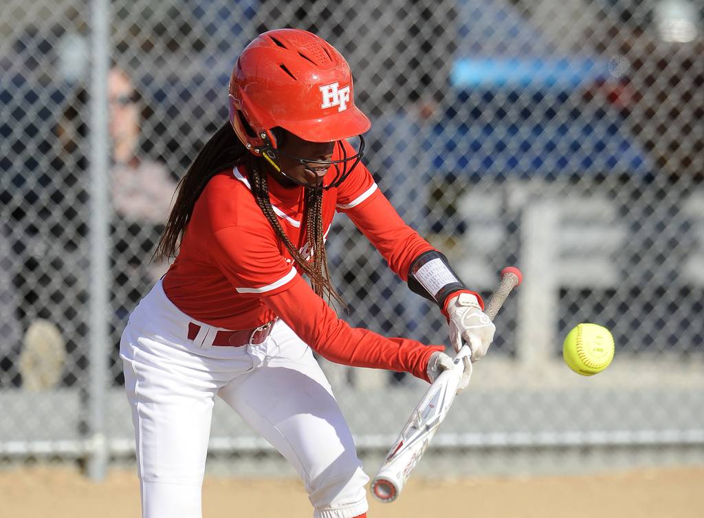 Homewood-Flossmoor's Toni Purchas (7) lays down a sacrifice bunt against Sandburg during a SouthWest Suburban Blue game in Orland Park on Tuesday, April 18, 2023.