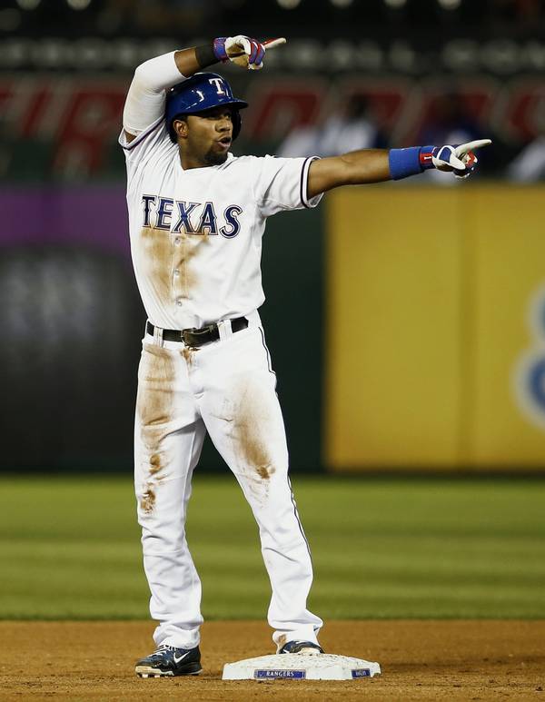 The Rangers' Elvis Andrus points to his team dugout after a double on May 1, 2015.