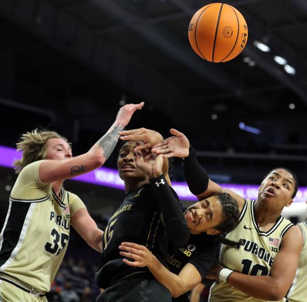 Purdue's Jeanae Terry) fouls Northwestern's Laya Hartman in the second half of a game on Feb. 24, 2022, at Welsh-Ryan Arena.