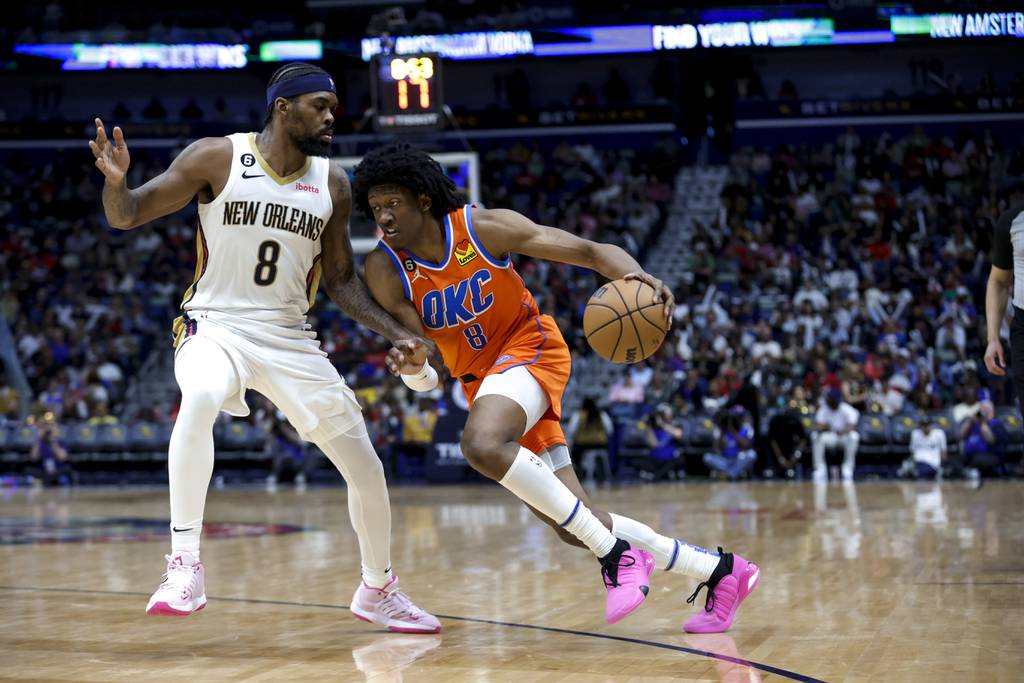 Thunder forward Jalen Williams drives past Pelicans forward Naji Marshall in the second half of a game on March 11, 2023.