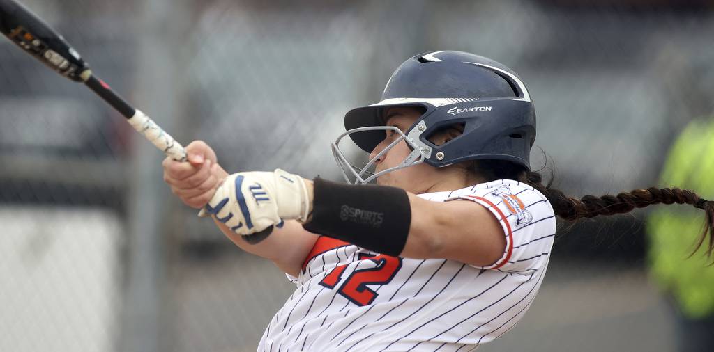 Oswego's Aubriella Garza connects for a grand slam home run in a nonconference game with Metea Valley on Monday, April 3, 2023.
