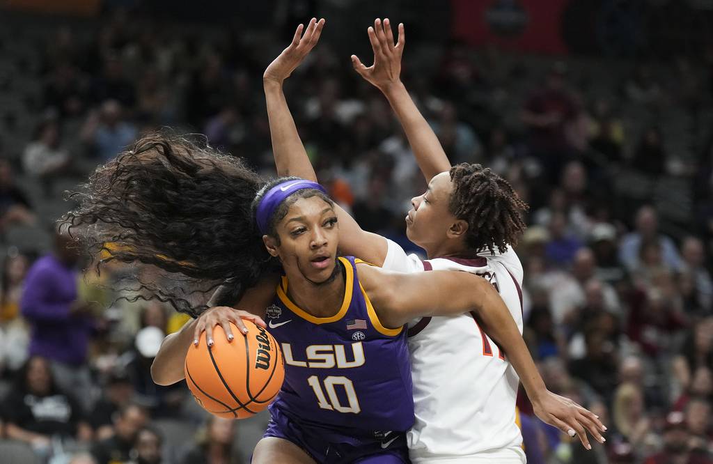 LSU forward Angel Reese drives against Virginia Tech forward Taylor Soule during the first half of an NCAA Final Four semifinal on Friday in Dallas.