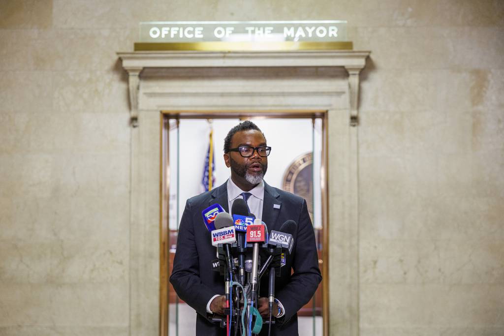 Mayor-elect Brandon Johnson speaks with the press after meeting with Mayor Lori Lightfoot at City Hall on April 6, 2023, in Chicago.