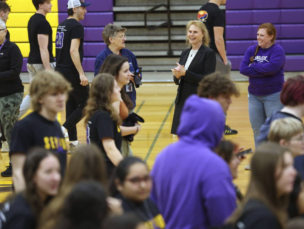 Rolling Meadows High School Principal Eileen Hart watches as seniors exit the gym on April 24, 2023.