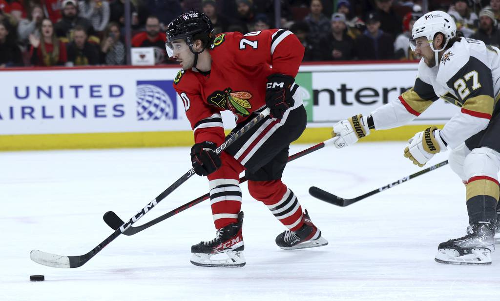 Blackhawks center Cole Guttman (70) breaks away before scoring a goal in the first period against the Golden Knights on Feb. 21 at the United Center. 